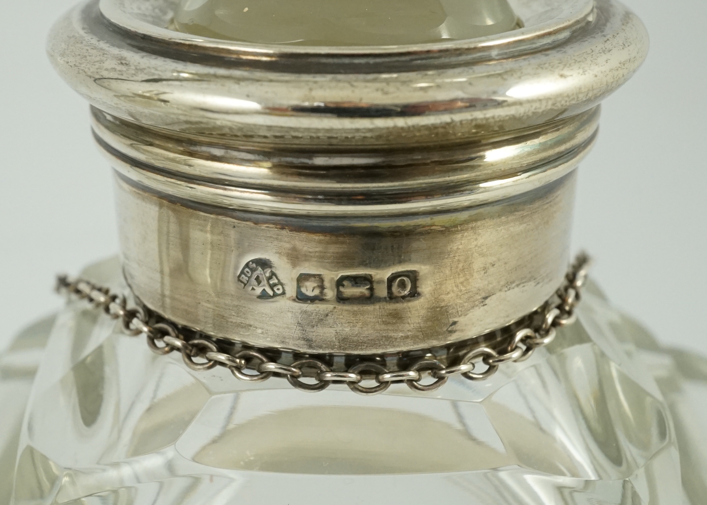 A pair of George VI silver mounted glass decanters and stoppers, by Adie Bros, presented to Mr. J.M. Gordon, to celebrate fifty five years with the D'Oyly Carte Opera Company